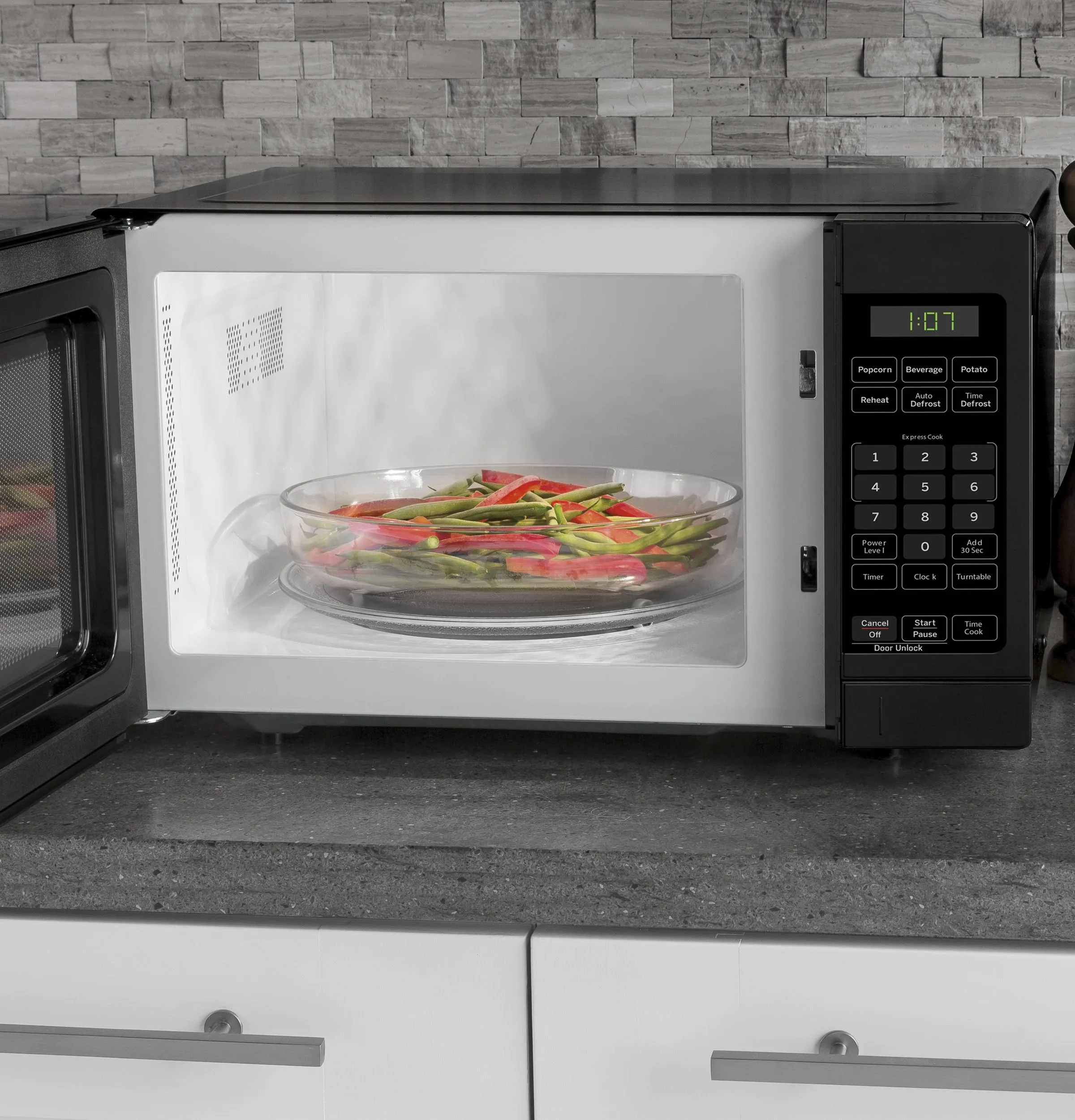 Ge Appliances GCHK07N1WBB Ge 0.7 Cu. Ft. Spacemaker Countertop Microwave Oven